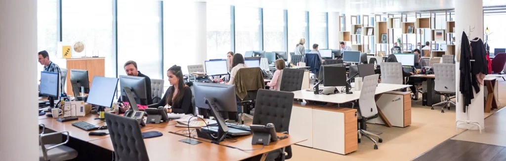 Review for business IT support in Exton PA, photo of a busy sales office with lots of computers and printers